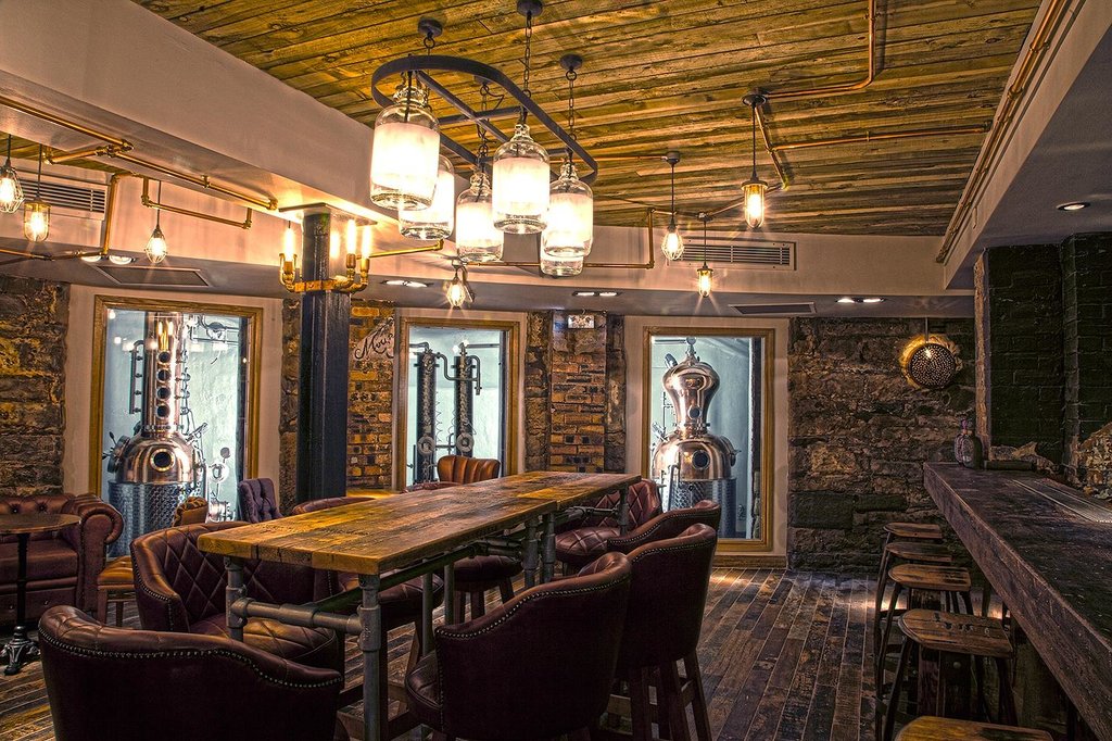 An Edinburgh gin tasting flight in a copper-still distillery bar