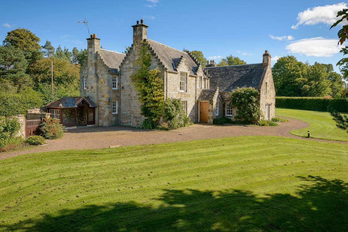 Georgian Cottage exterior with extensive garden on the castle estate