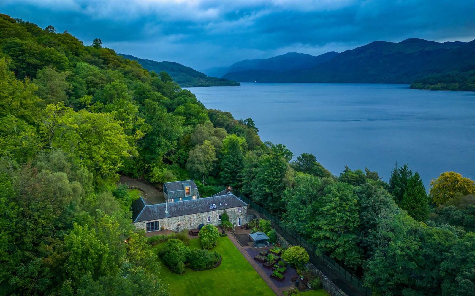Luxury Loch Lomond House from above, on the shore of Loch Lomond