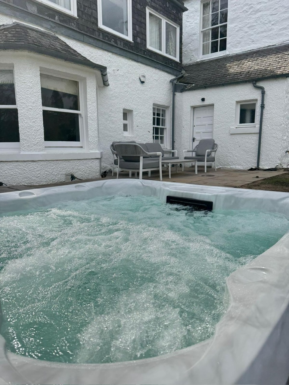 Outdoor hot tub in the grounds of The Loch House, Highland Perthshire