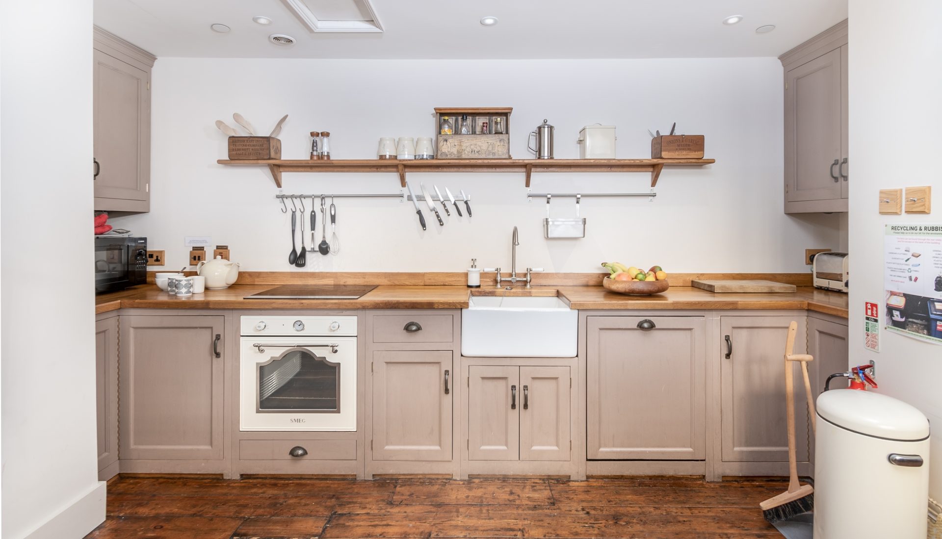 Mushroom shaker kitchen with butcher-block counter, Belfast sink and vintage cream Smeg oven