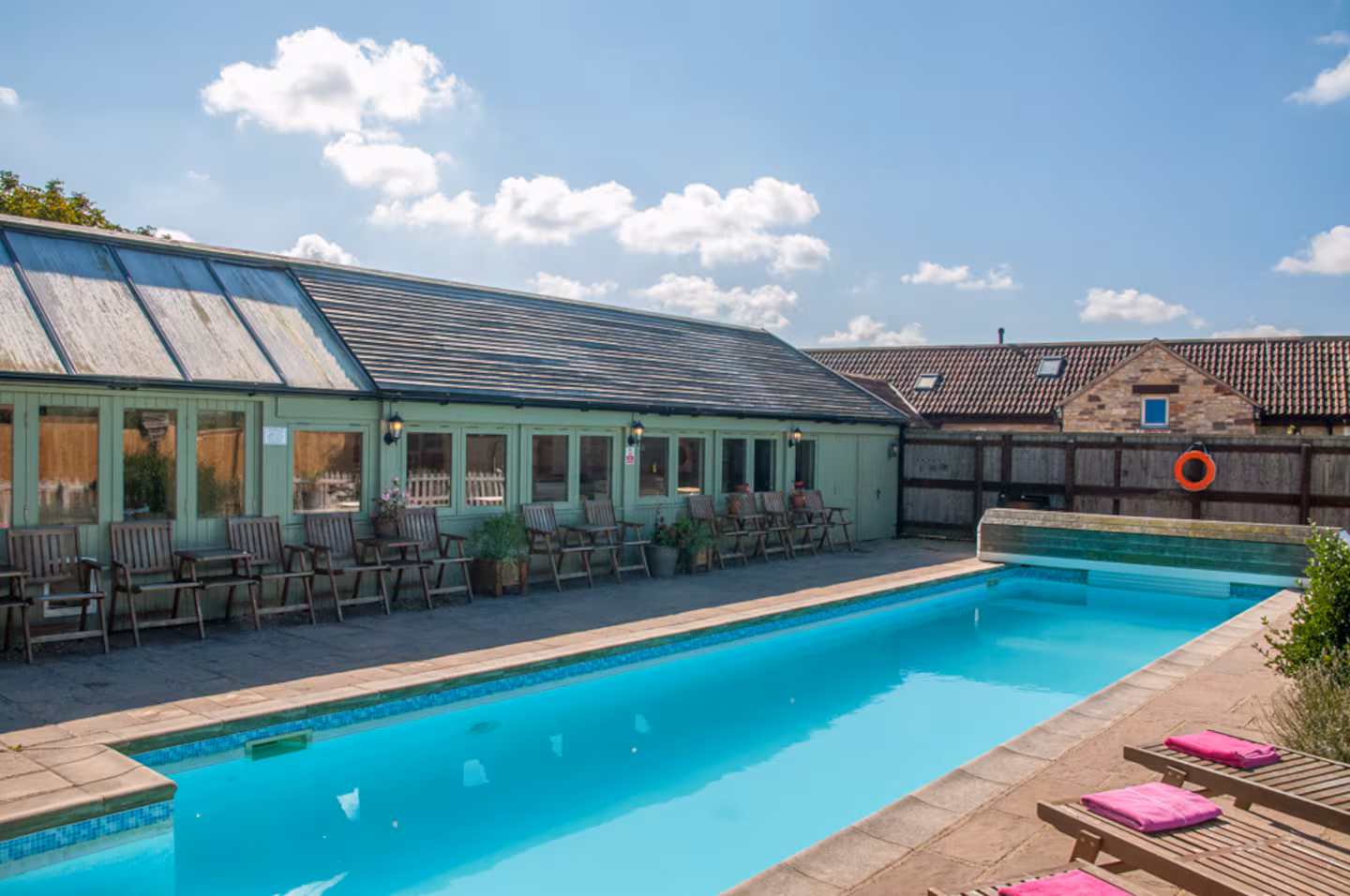 The Pool Club 30ft heated outdoor pool with sun loungers