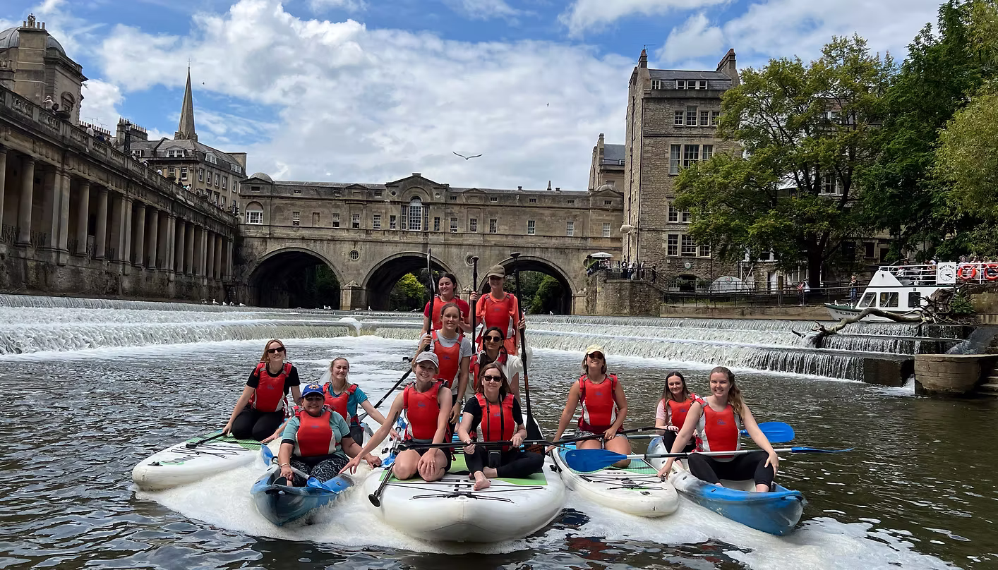 Hen group paddleboarding on the River Avon, Bath