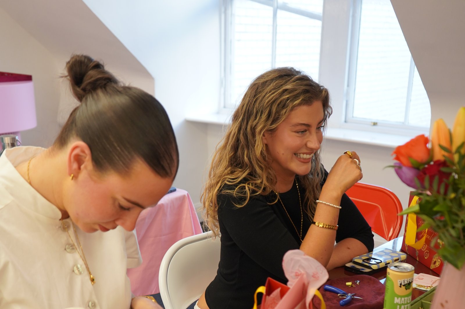 Hen group designing custom charm necklaces at the Recreation Jewels Charm Bar