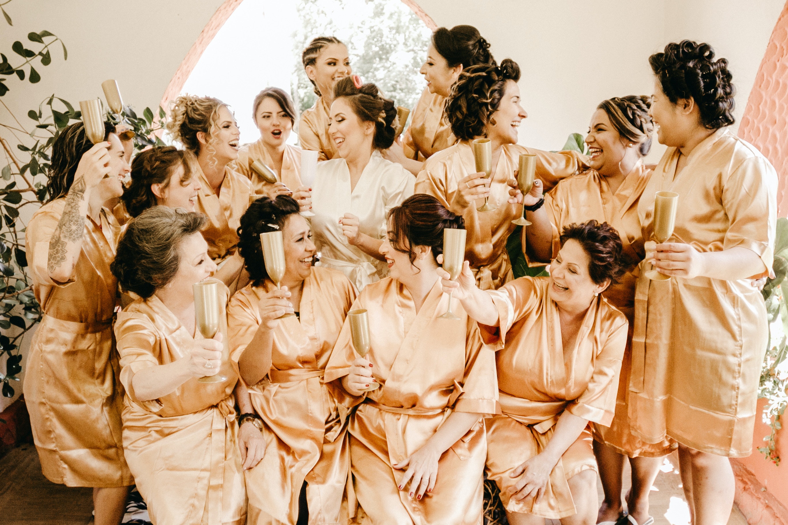A hen group laughing around a kitchen table set up for games