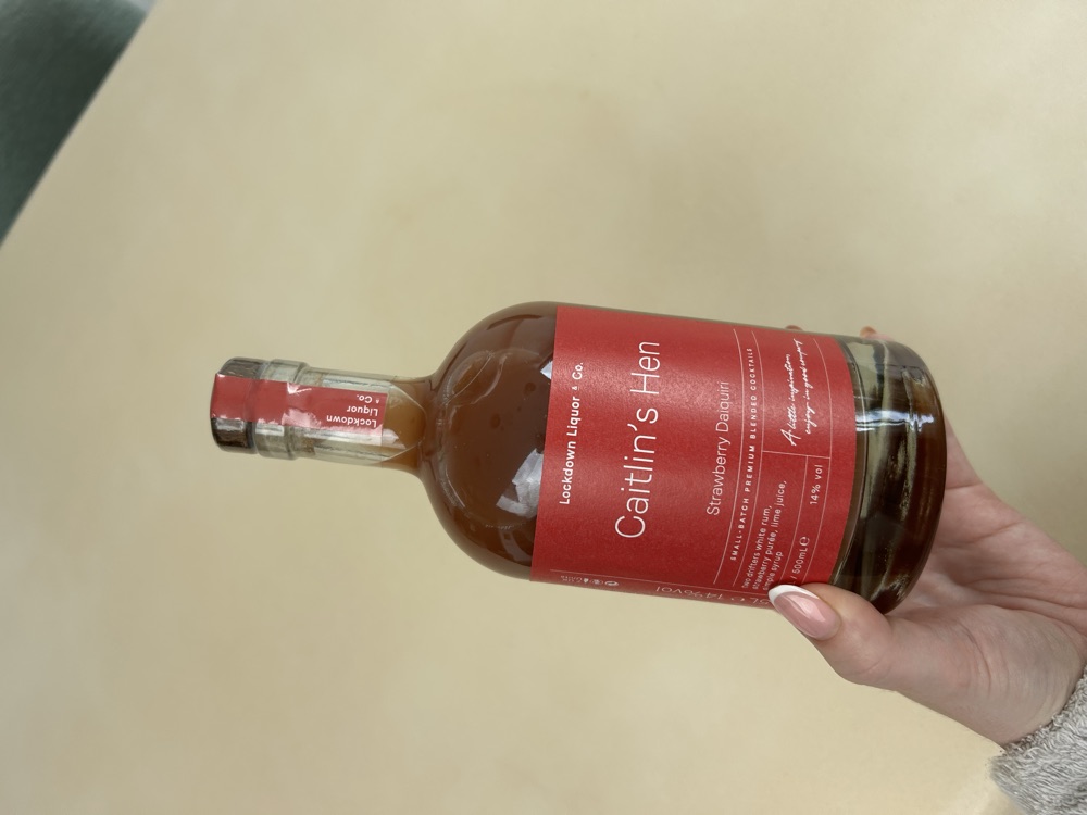 Personalised Lockdown Liquor & Co. cocktail bottle labelled Caitlin's Hen, a strawberry daiquiri